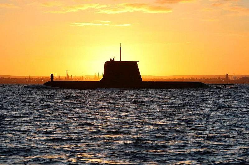 HMAS Collins sails out through the channel to meet HMAS Waller and HMAS Rankin at Gage Roads at sunrise. 