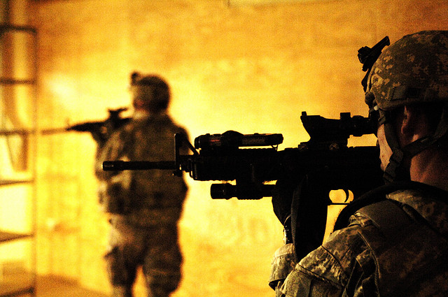 U.S. Army Soldiers assigned to 213th Psychological Operations Company observe reaction after playing an announcement over a loud speaker out of Joint Security Station Oubaidy located just outside Sadr City, Iraq, after a series of rocket and mortar attacks, March 29, 2008