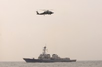 The guided-missile destroyer USS Lassen (DDG 82) and an SH-60F Seahawk helicopter assigned to Helicopter Anti-submarine Squadron Light (HSL) 51, Detachment 1, are participating in Eastern Endeavor 2010