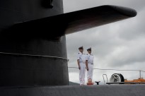 Chinese People's Liberation Army-Navy sailors stand watch on the submarine Yuan at the Zhoushan Naval Base in China on July 13, 2011