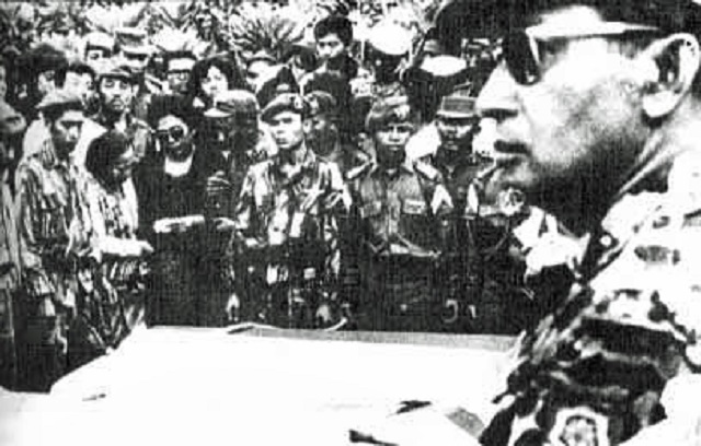 As Major General, Suharto (at right, foreground) attends funeral for assassinated generals 5 October 1965.