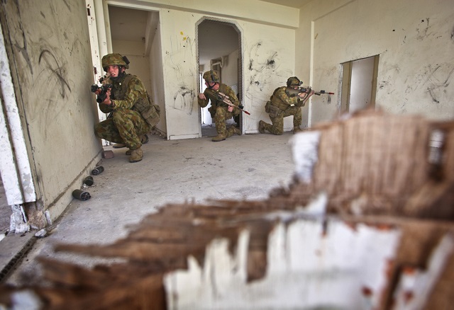 Members of Rifle Company Butterworth carry-out Urban Operations Training during Exercise Bersama Lima 2014. *** Local Caption *** Exercise Bersama Lima 2014 (BL14) was a Five Power Defence Arrangements (FPDA) major tactical Command Post Exercise and Field Training Exercise held in the Singapore, Malaysia and the South China Sea from 7  22 October. The aim of BL14 was to enhance interoperability and strengthen the professional relationships of the FPDA nations (Australia, Malaysia, New Zealand, Singapore and the United Kingdom) by conducting maritime, land and air operations in a simulated multi-threat environment. Approximately 500 Australian Defence Force personnel were involved in BL14 from all three Services.