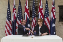 U.S. Defense Secretary Ash Carter and Australian Defense Minister Marise Payne shake hands after signing a U.S.-Australia defense statement at the Boston Public Library during the Australia-U.S. Ministerial Consultations in Boston, Oct. 13, 2015.